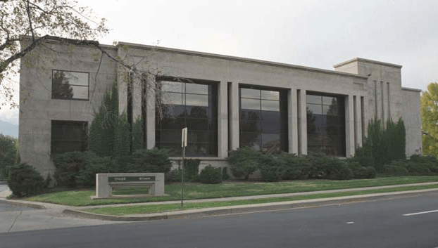 A historic building on the corner of a street, Shepard's Citations Building, built in 1947 by architects Thomas and Sweet.